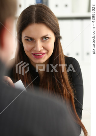 Man and smiling mature woman talking in office Man and smiling mature woman talking in office 48993028