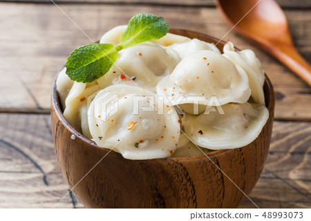 Dumplings stuffed with meat, ravioli, dumplings.  48993073