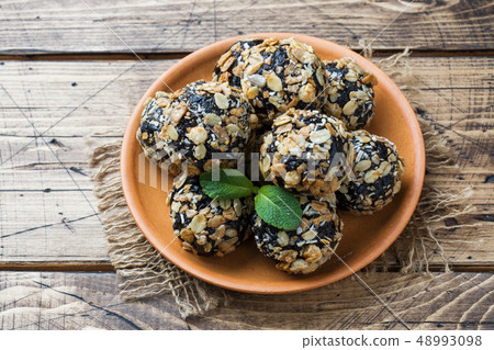 Healthy energy balls made of dried fruits and nuts Healthy energy balls made of dried fruits and nuts 48993098