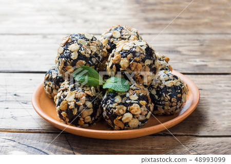 Healthy energy balls made of dried fruits and nuts Healthy energy balls made of dried fruits and nuts 48993099