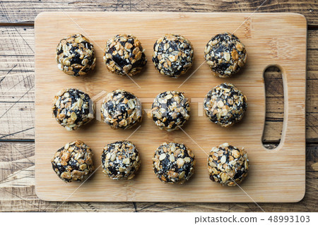 Healthy energy balls made of dried fruits and nuts Healthy energy balls made of dried fruits and nuts 48993103