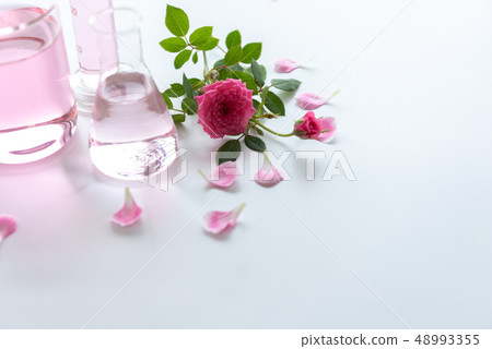 Rose spa treatments on white wooden table. 48993355