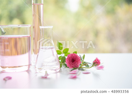 Rose spa treatments on white wooden table. 48993356