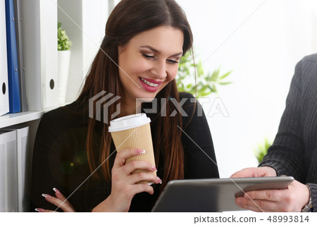 Group of people in office look at mobile tablet pc 48993814
