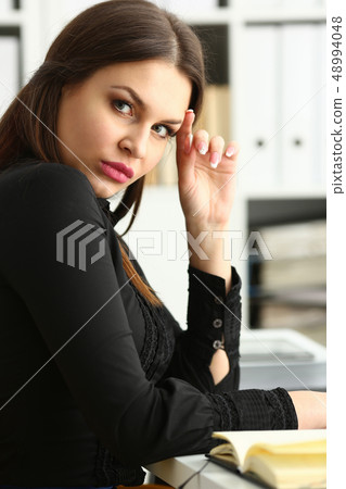 Businesswoman in the workplace in the office Businesswoman in the workplace in the office 48994048