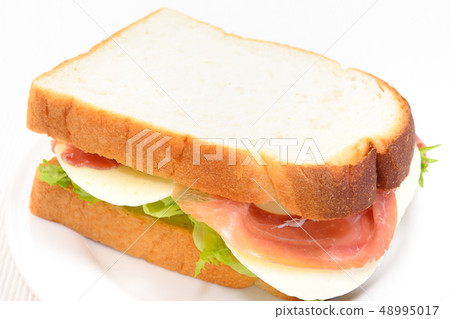 Delicious raw ham cheese sandwich 48995017