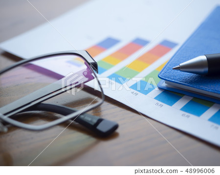 Business image · graph · notebook · glasses Business image · graph · notebook · glasses 48996006