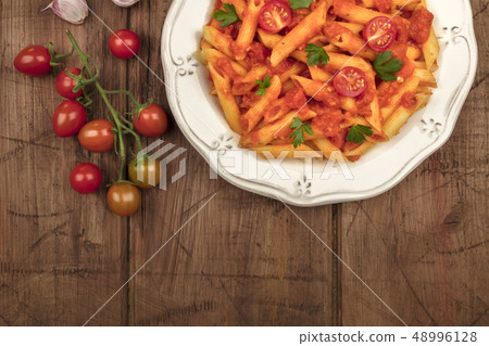Penne pasta with tomato sauce and place for text Penne pasta with tomato sauce and place for text 48996128