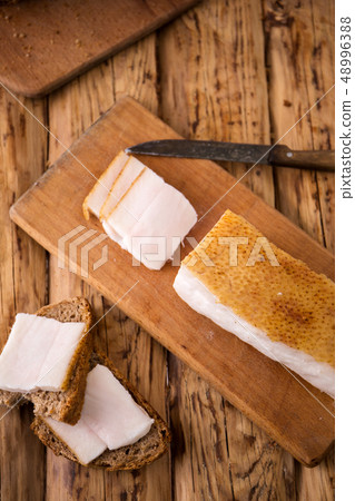 Ukrainian sandwich with bacon on the board Ukrainian sandwich with bacon on the board 48996388