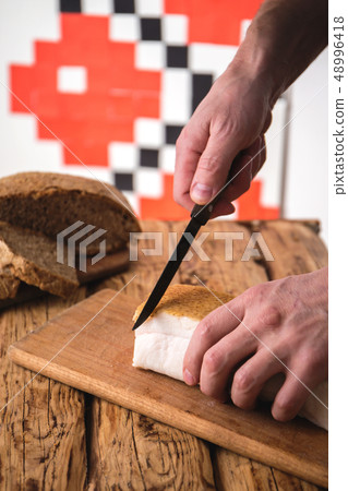 Man cuts fat 48996418