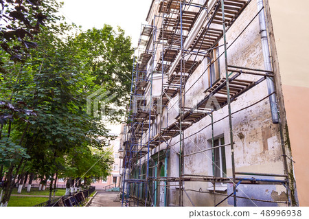 Scaffolding during the repair of the facade of a 48996938