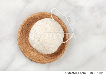 An overhead photo of a natural biodegradable Konjac sponge, shot from the top with a place for text 48997404