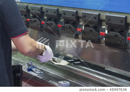 The technician operator use hydraulic bending The technician operator use hydraulic bending 48997636