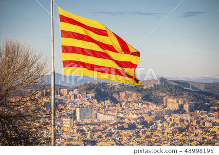 Flag of Catalonia. Sanyor flies over Barcelona Flag of Catalonia. Sanyor flies over Barcelona 48998195