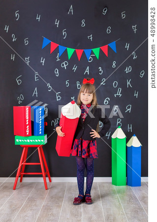 Cute school girl posing in studio shoot in school 48998428