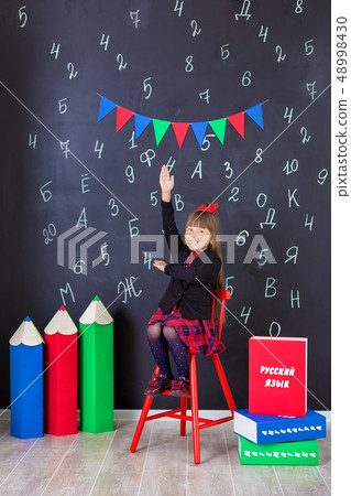Cute school girl posing in studio shoot in school Cute school girl posing in studio shoot in school 48998430