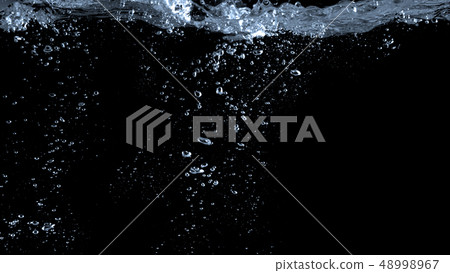 Blurry images of soda bubbles splashing in black Blurry images of soda bubbles splashing in black 48998967