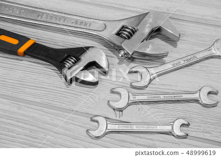 adjustable spanners and wrenches on the table adjustable spanners and wrenches on the table 48999619