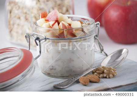 Homemade Bircher Muesli with nuts and apples 49000331
