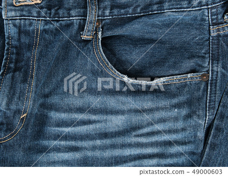 frayed empty front pocket of blue jeans frayed empty front pocket of blue jeans 49000603