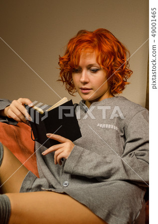 Red woman reading Red woman reading 49001465