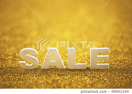 Word sale over golden glitter background Word sale over golden glitter background 49002204