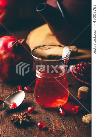 Black tea with pomegranate seeds and some spices 49002763