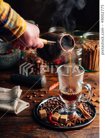 Man Pour Coffee in Mug. 49002775