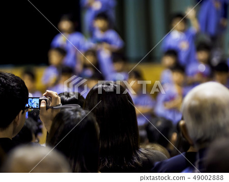 Back view of parents watching a learning presentation 49002888