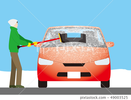 Use a squeegee to remove frost on the windshield of the car 49003525