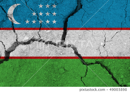 Uzbekistan flag on the cracked earth 49003898