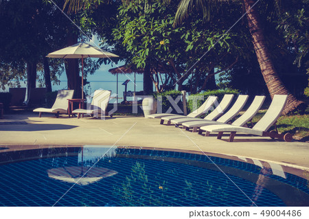 Beautiful luxury outdoor swimming pool Beautiful luxury outdoor swimming pool 49004486