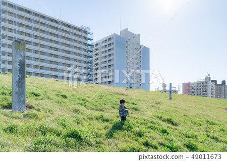 Bank near the housing complex 49011673