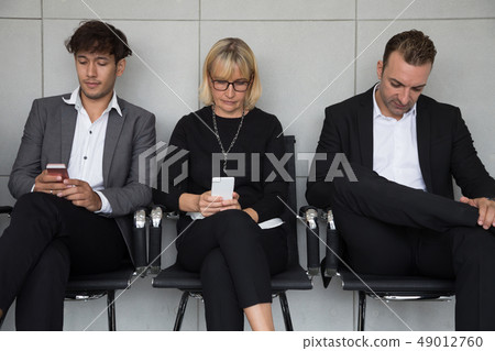 People sitting waiting for a job interview People sitting waiting for a job interview 49012760
