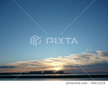 Sunrise with blue sky and clouds Sunrise with blue sky and clouds 49012816
