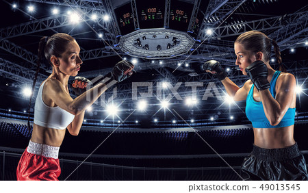 Girls boxing in ring 49013545