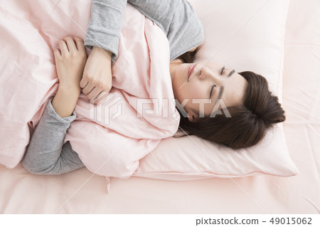 A woman sleeping A woman sleeping 49015062