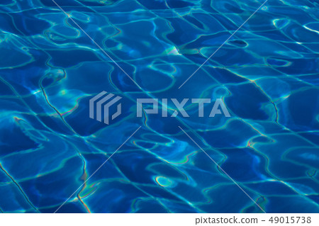 Blue and bright ripple water surface in swimming 49015738