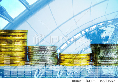 Double exposure of coin stack with financial graph Double exposure of coin stack with financial graph 49015952