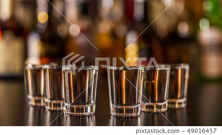 Traditional pure vodka in glasses on a black 49016457