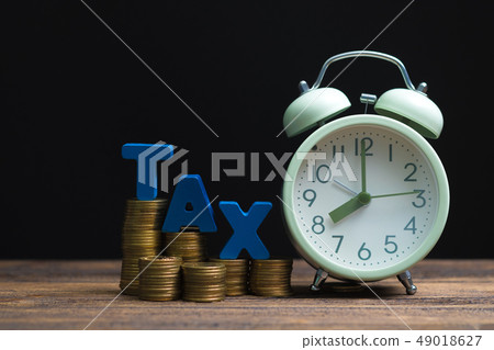 Time to pay TAX concept. TAX alphabet with stack 49018627