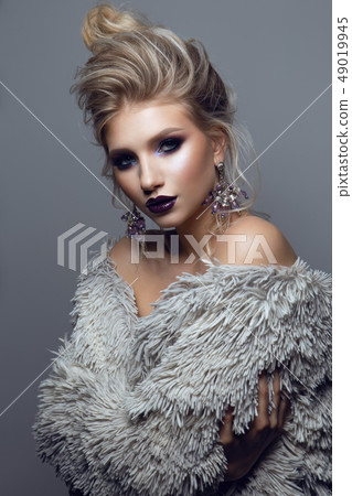 Portrait of beautiful girl with dark lips. Portrait of beautiful girl with dark lips. 49019945