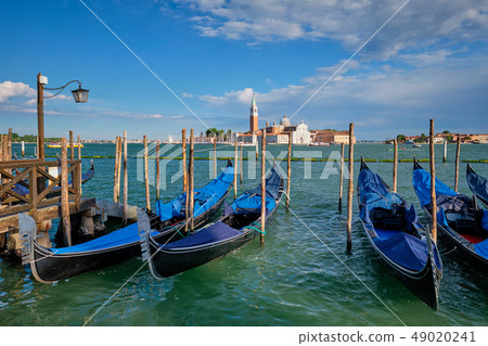 Gondolas and in lagoon of Venice by San Marco square. Venice, Italy 49020241