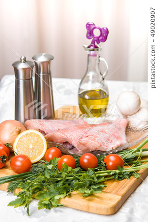 Fresh sea bass fillets and cut and clean Fresh sea bass fillets and cut and clean 49020907