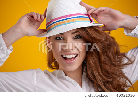 Portrait of a beautiful spring woman. Orange  49021030