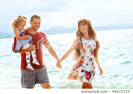 family with child by the sea 49022325