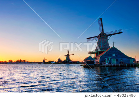 Windmills at Zaanse Schans in Holland on sunset. Zaandam, Netherlands 49022496