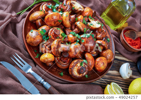 close-up of tasty spicy lightly fried mushrooms close-up of tasty spicy lightly fried mushrooms 49024257