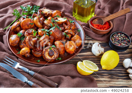 close up of spicy lightly fried champignons close up of spicy lightly fried champignons 49024258