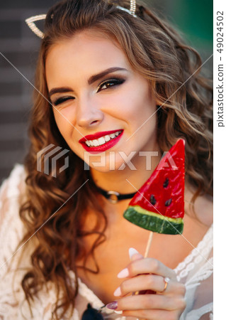 Portrait of positive sexy brunette with red lips 49024502